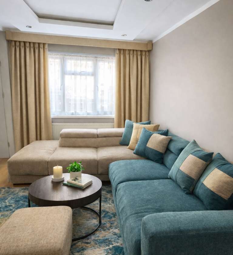 Modern living room with neutral bespoke curtains and sofa design London