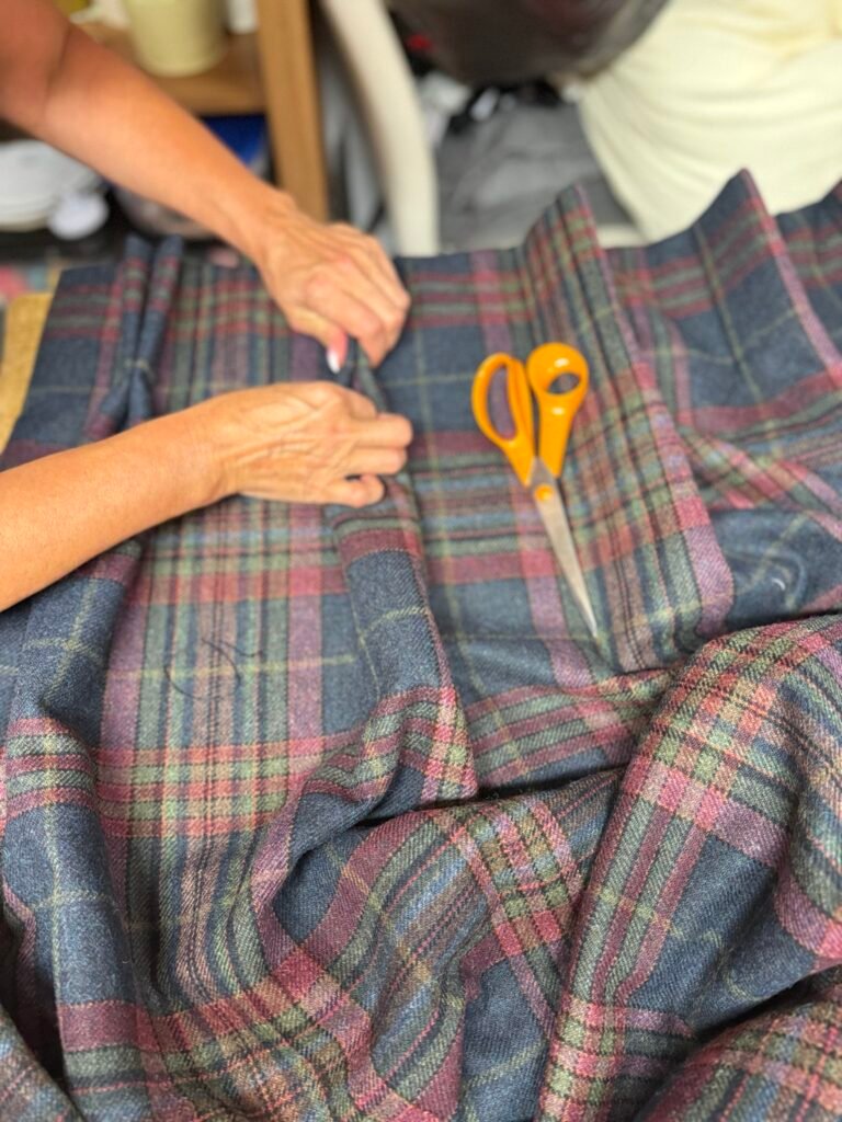 Hand finishing made-to-measure tartan curtains